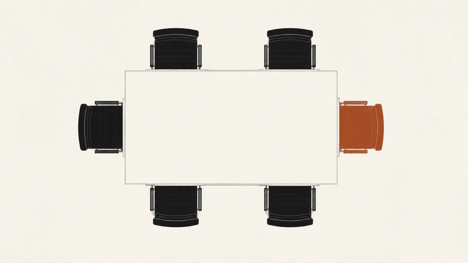 A meeting table seen from above with six chairs, one of them marked in rust.