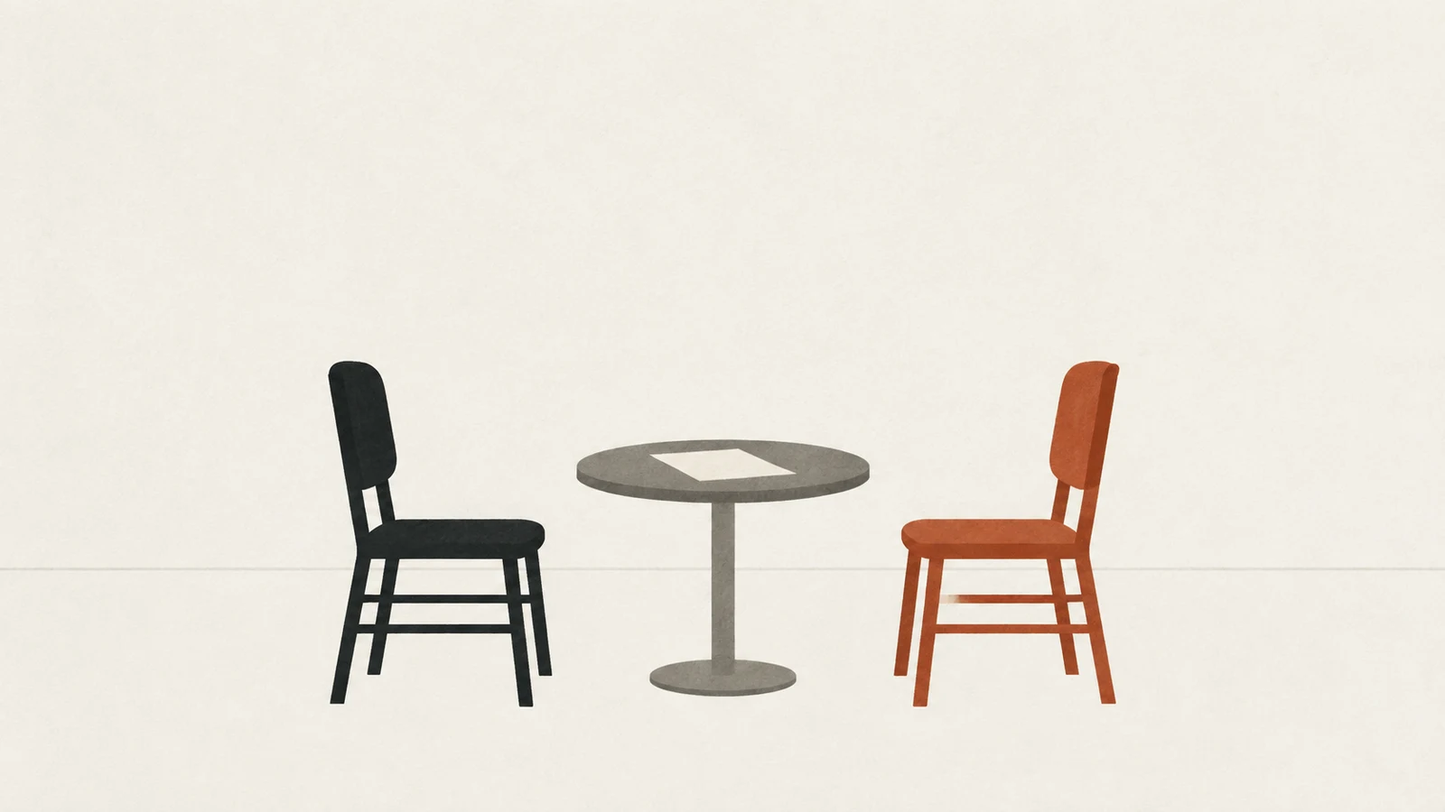 Two chairs of equal size facing each other across a small table with one sheet of paper on it.