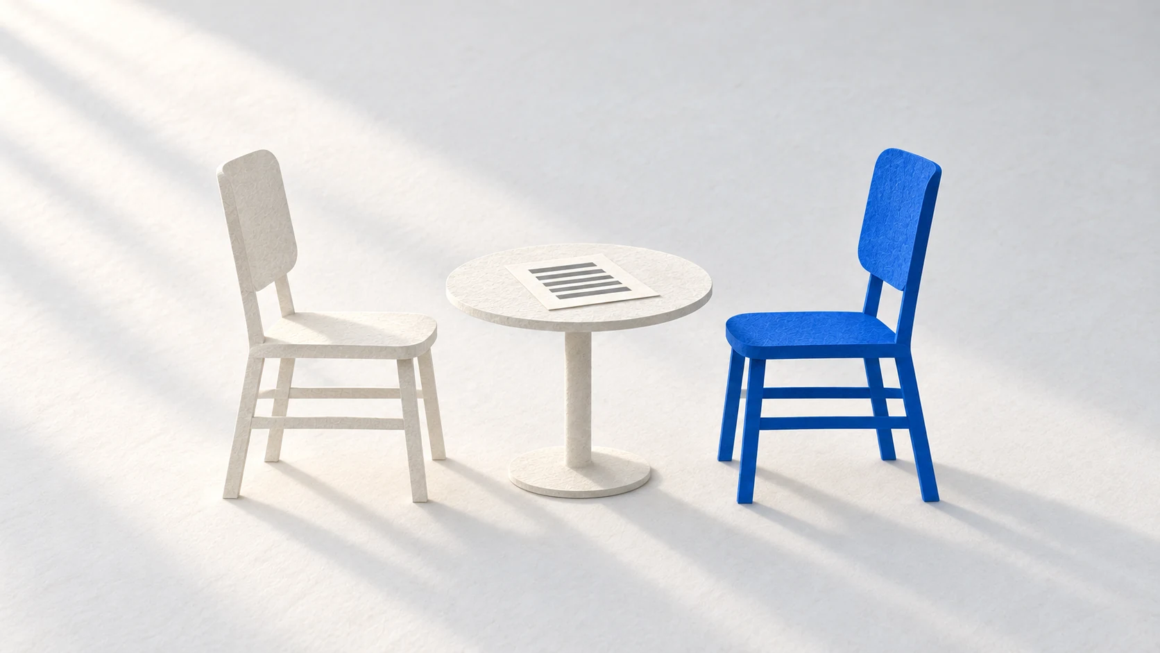 Two equal chairs face one shared work sheet, suggesting a colleague whose habits must be learned.